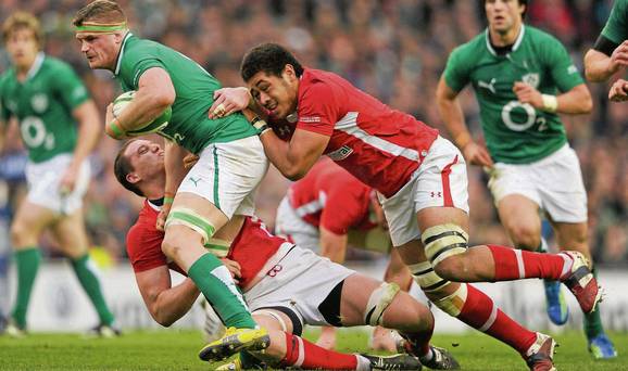 Sam Warburton and Taulupe ['Toby'] Faletau tackle Jamie Heaslip in the 2012 Six Nations game. 
